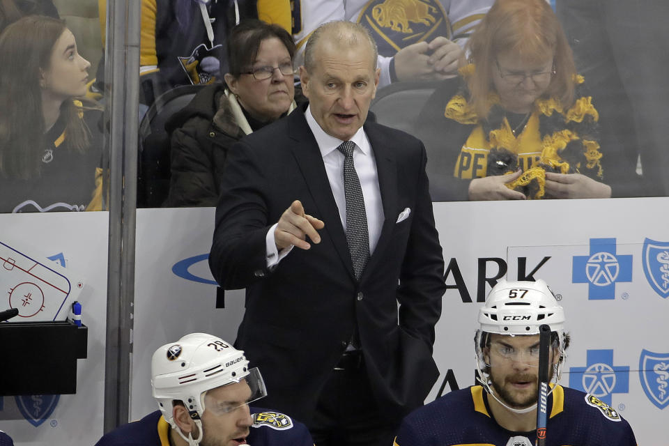 FILE - Buffalo Sabres' head coach Ralph Krueger stands behind his bench during the first period of the team's NHL hockey game against the Pittsburgh Penguins in Pittsburgh, in this Saturday, Feb. 22, 2020, file photo. Sabres coach Krueger prefers viewing the start of the 2021 shortened season as a continuation of the last one. If that's the case, the new-look Sabres, with the addition of Taylor Hall and Eric Staal, have plenty of unfinished business in attempting to snap a nine-year playoff drought, the NHL's longest active streak.(AP Photo/Gene J. Puskar, File)