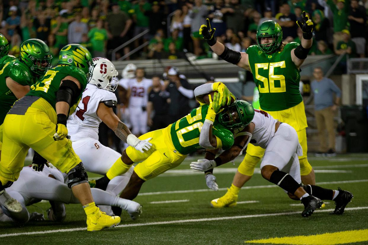 Oregon running back Jordan James dives into the end zone for a touchdown as the Oregon Ducks take on the Stanford Cardinal Saturday, Oct. 1, 2022, at Autzen Stadium in Eugene, Ore.