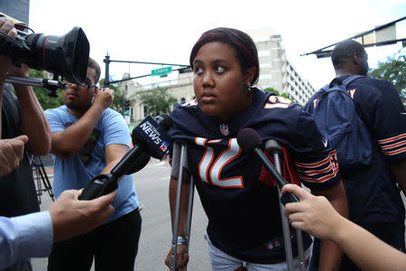 Taylor Poindexter speaks to reporters after witnessing a gunman open fire on gamers participating in a video game tournament outside The Jacksonville Landing in Jacksonville, Florida August 26, 2018. REUTERS/Joey Roulette