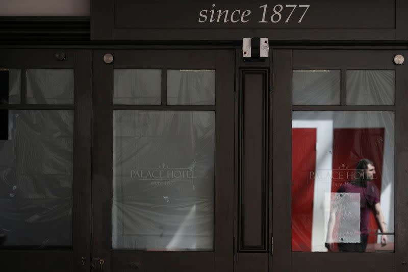 A closed shop with the windows covered with plastic is seen following the implementation of stricter social-distancing and self-isolation rules to limit the spread of the coronavirus disease (COVID-19) in Sydney