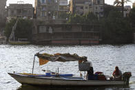 A partially demolished houseboat sits on the banks of the Nile River after being moved from their moorings on July 1, 2022. A government push to remove the string of houseboats from Cairo’s Nile banks has dwindled their numbers from a several dozen to just a handful. The move ends a tradition that dates back to the 1800s, and has drawn criticism in Egypt, where residents are mourning the loss of their homes but also a way of life. The government says it plans to develop the waterfront. (AP Photo/Tarek Wagih)