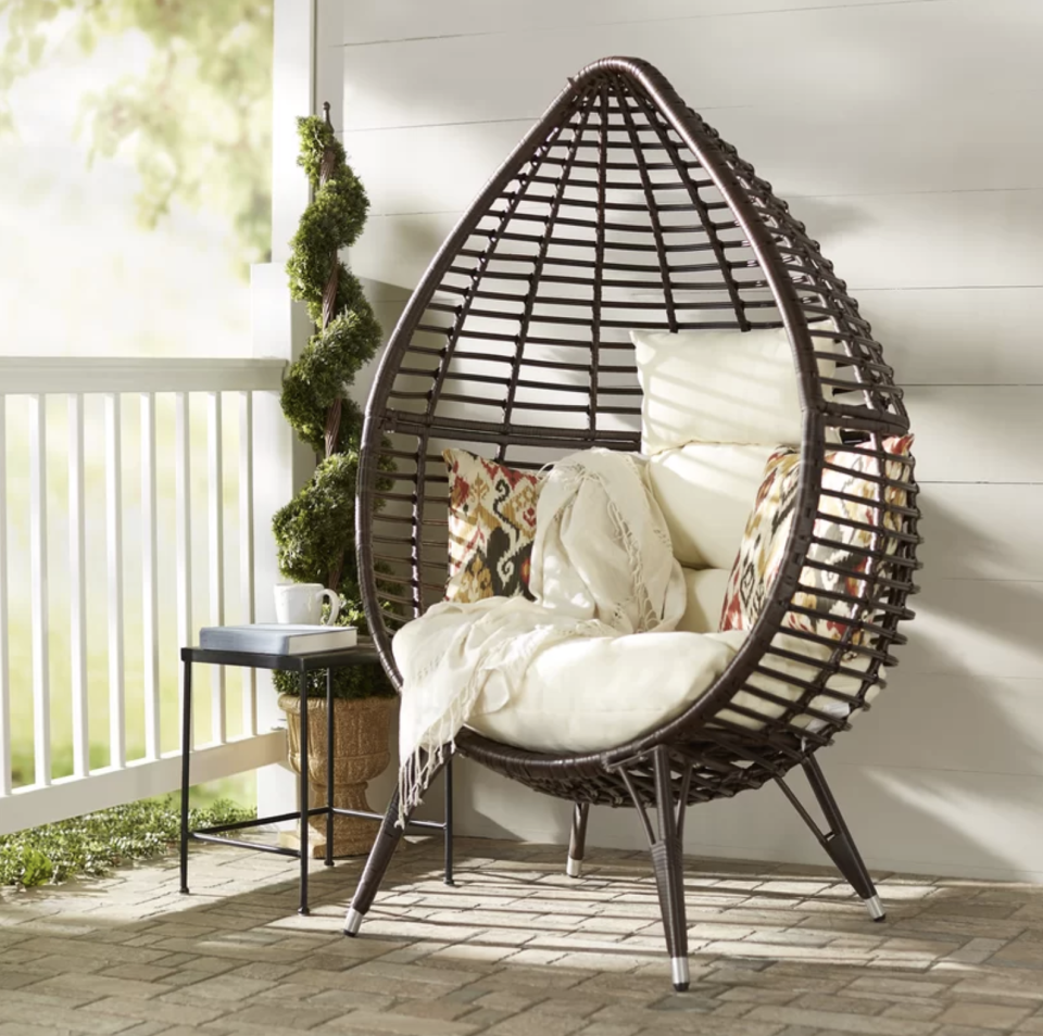 Imagine curling up with a book and a blanket in this teardrop chair. (Photo: Wayfair)