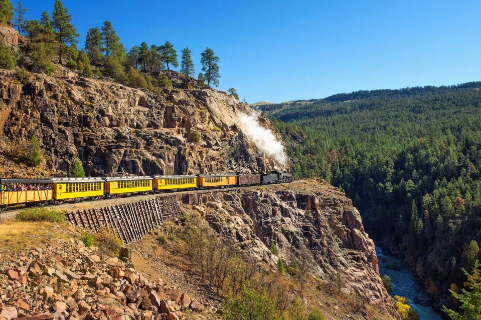 Historic steam engine train travels from Durango to Silverton through the San Juan Mountains in Colorado