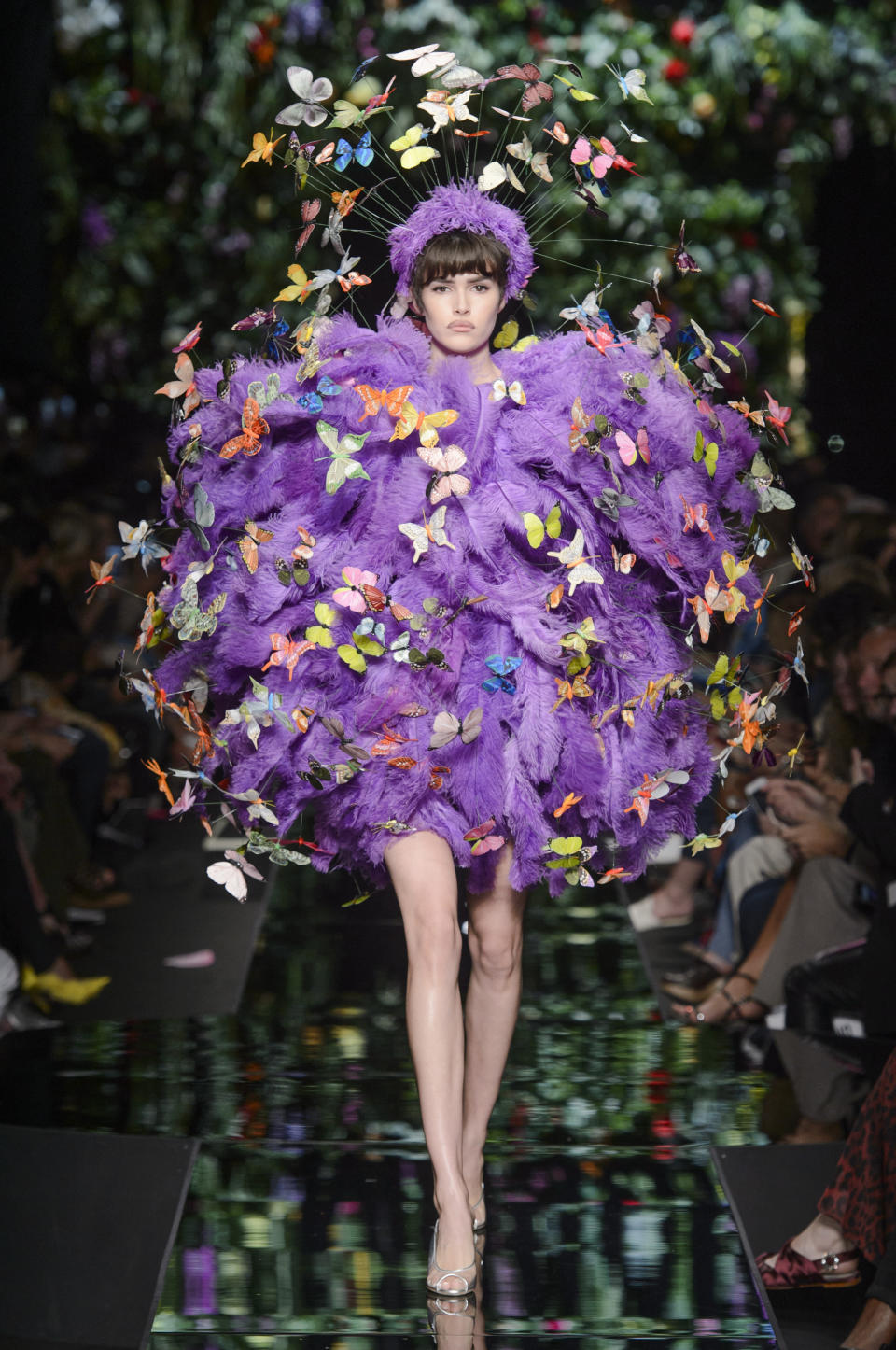 <p><i>Purple feather ball and butterfly appliqués from the SS18 Moschino collection. (Photo: ImaxTree) </i></p>