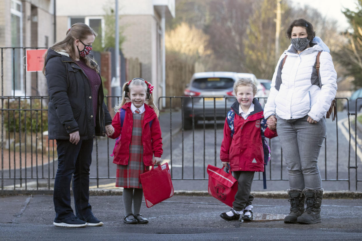 Parents have been urged not to socialise at the school gate as some youngsters in Scotland returned to class (Jane Barlow/PA)