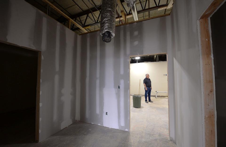 Kevin Simmers, founder of Brooke's House, checks work inside a recovery center that is under construction at the South End Shopping Center. The 4,150 square-foot facility will provide walk-in assessments for those suffering from addiction.