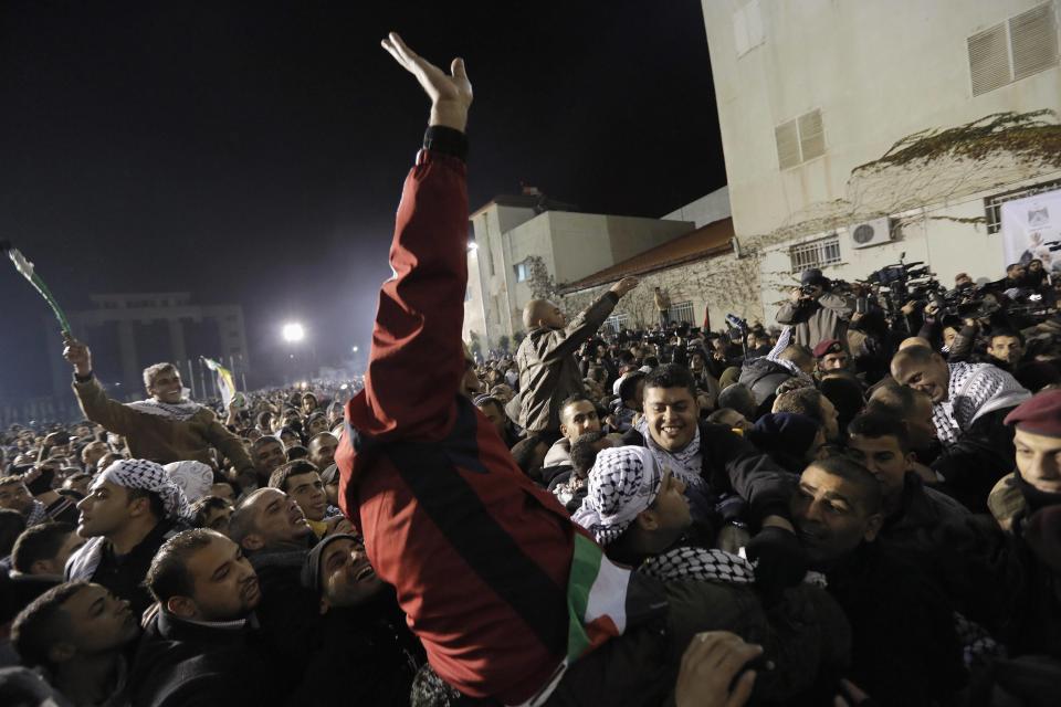 Prisoners released by Israel are welcomed by relatives and friends in the West Bank city of Ramallah