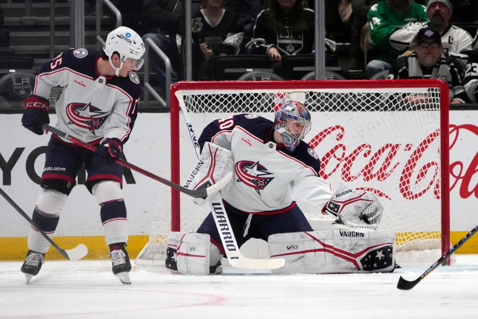 Columbus Blue Jackets goaltender Daniil Tarasov stops a shot during the first period of an NHL hockey game Thursday, March 16, 2023, in Los Angeles. (AP Photo/Marcio Jose Sanchez)