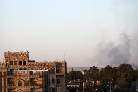 Smoke billows near military barracks in the Jabal al-Jumaima mountain following an air strike near Sanaa March 30, 2015. REUTERS/Mohamed al-Sayaghi