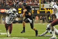 Quarterback Jordan Rodgers #11 of the Vanderbilt Commodores tries to avoid Brison Williams #12 of the South Carolina Gamecocks at Vanderbilt Stadium on August 30, 2012 in Nashville, Tennessee. (Photo by Frederick Breedon/Getty Images)