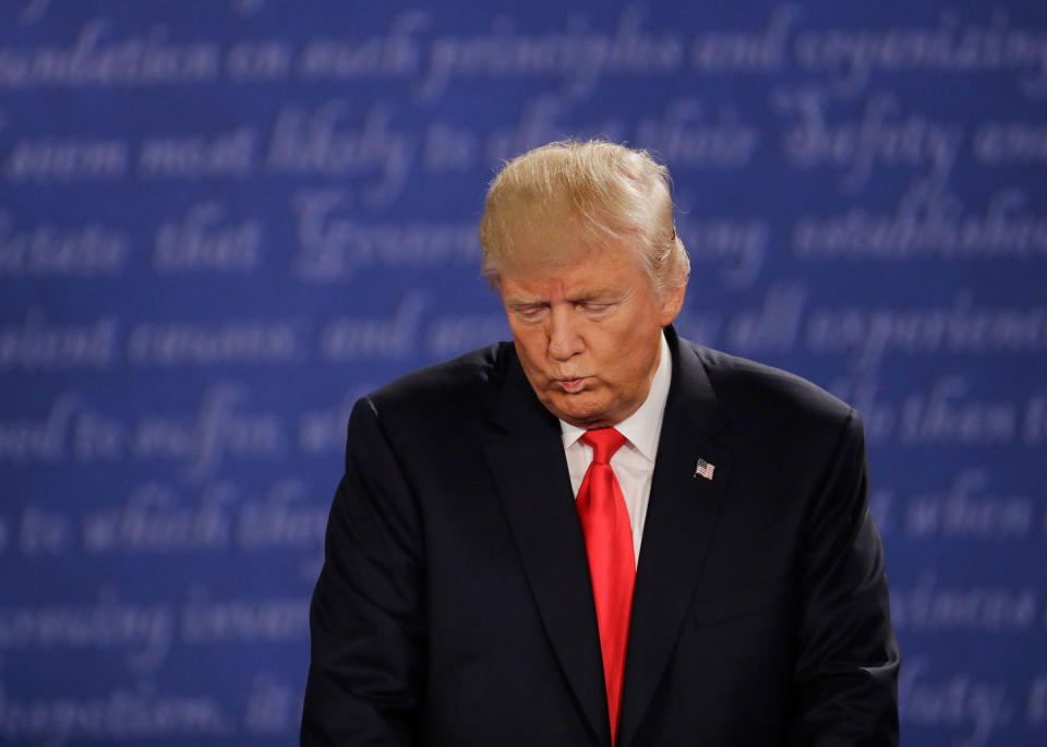 <p>Republican presidential nominee Donald Trump listens to Democratic presidential nominee Hillary Clinton during the second presidential debate at Washington University in St. Louis, Mo., Sunday, Oct. 9, 2016. (Photo: Patrick Semansky/AP) </p>