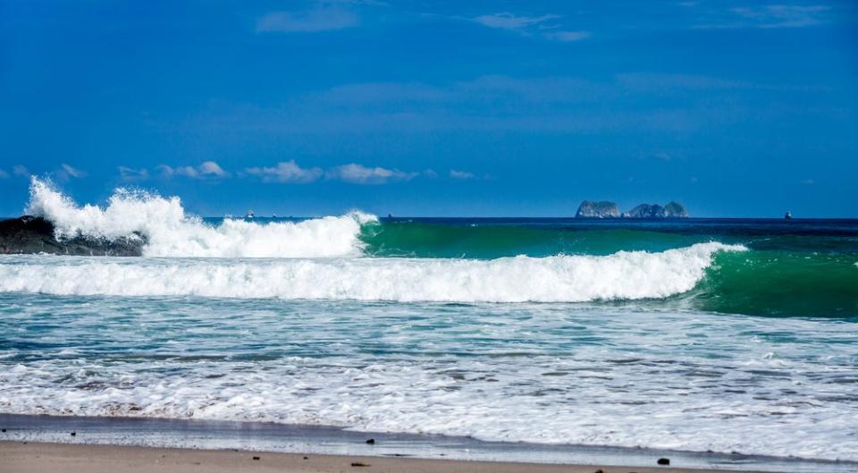 waves breaking on shore in Costa Rica