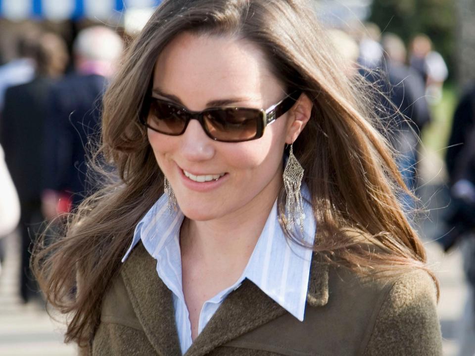 Kate Middleton wearing sunglasses, a button-down shirt, and a blazer before royal life.