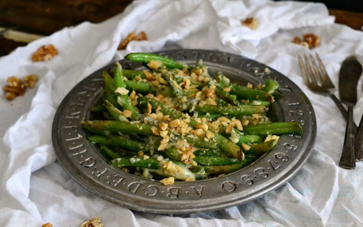 <p>Courtesy of Clair Gallam</p><p>A bold combination of flavors makes this a green bean recipe to remember.</p><p><strong>Get the Recipe: <a href="/841289/clairegallam/blue-cheese-walnut-roasted-green-beans/" data-ylk="slk:Blue Cheese Walnut Green Beans;elm:context_link;itc:0;sec:content-canvas" class="link rapid-noclick-resp">Blue Cheese Walnut Green Beans</a></strong></p>