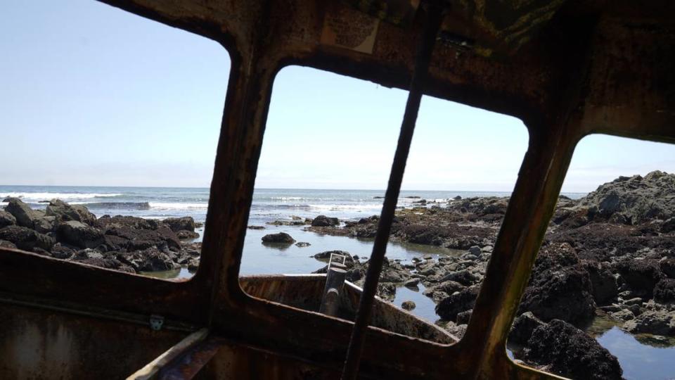 Fisherman Jonathan Smith ran aground in Estero Bay in 2017. His boat remains on the shore, and visitors climbed aboard to see a view of the ocean through what once was the windows.