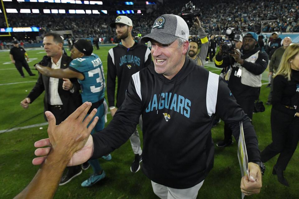 Jacksonville Jaguars head coach Doug Pederson is congratulated after Saturday night's win over the Tennessee Titans. The Jacksonville Jaguars hosted the Tennessee Titans to decide the AFC South championship at TIAA Bank Field in Jacksonville, FL, Saturday, January 7, 2023. The Jaguars went into the half trailing 7 to 13 but came back to win with a final score of 20 to 16. [Bob Self/Florida Times-Union]