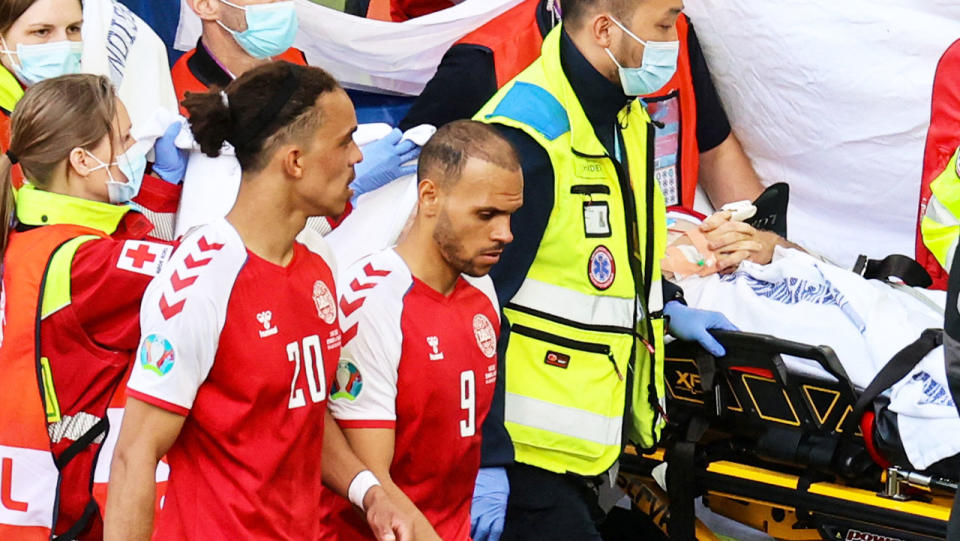 Teammates, pictured here escorting paramedics evacuating Christian Eriksen from the field. 