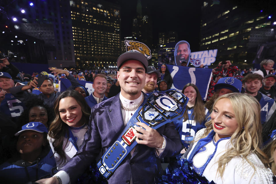 UCLA defensive lineman Laiatu Latu poses with fans after being selected by the Indianapolis Colts with the 15th overall pick during the first round of the NFL football draft, Thursday, April 25, 2024, in Detroit.  (Jeff Lewis/AP Images for the NFL)