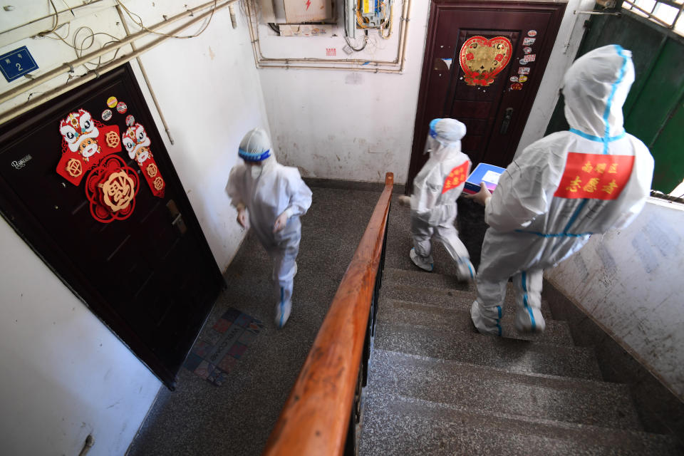 GUIYANG, CHINA - SEPTEMBER 7, 2022 - Staff members hand out antigen testing reagents in the stairs of their jurisdiction in Guiyang, Guizhou province, China, Sept 7, 2022. (Photo credit should read CFOTO/Future Publishing via Getty Images)