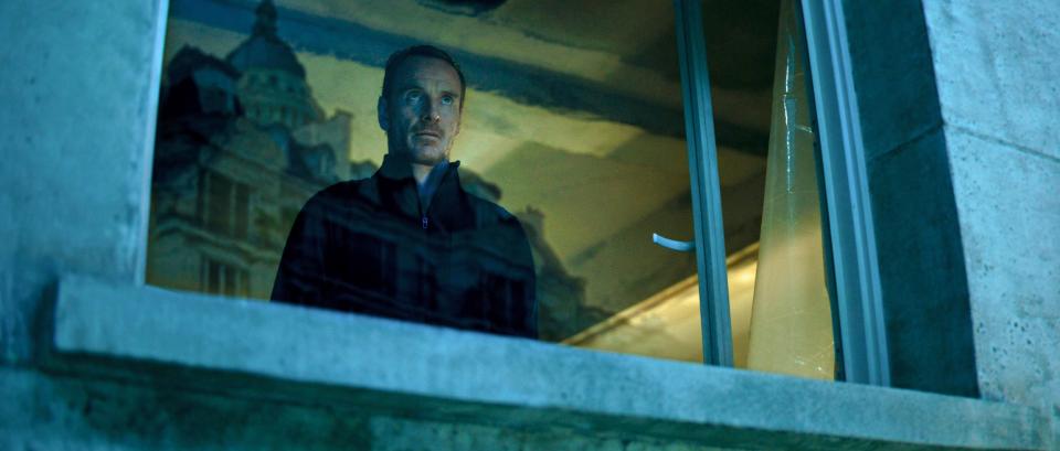 Michael Fassbender looking out a window