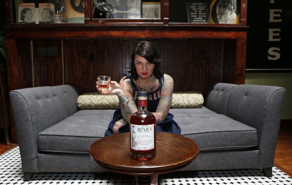 Molly Wellmann with a bottle of George Remus whiskey at Japp's in 2014.