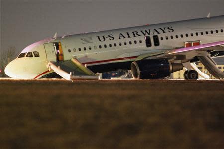 A U.S. Airways plane with a collapsed nose is seen at Philadelphia International Airport March 13, 2014. REUTERS/Tom Mihalek