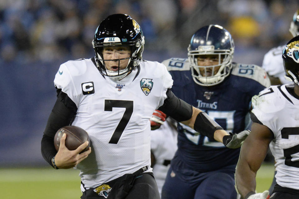 FLE - In this Nov. 24, 2019, file photo, Jacksonville Jaguars quarterback Nick Foles (7) scrambles against the Tennessee Titans in the second half of an NFL football game in Nashville, Tenn. A person familiar with the trade says the Jacksonville Jaguars have agreed to send quarterback Nick Foles to the Chicago Bears for a compensatory fourth-round draft pick. The person spoke to The Associated Press on condition of anonymity because trades don't become official until the league year begins later Wednesday, March 18, 2020. (AP Photo/Mark Zaleski, File)