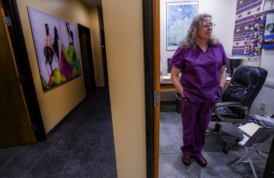 A woman standing in an office