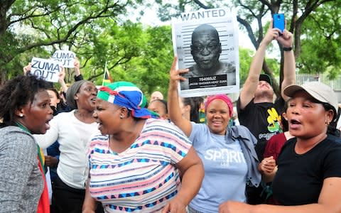 Protestors outside the Gupta's Saxonwold residence call for President Zuma to step down in April - Credit:  Gallo Images