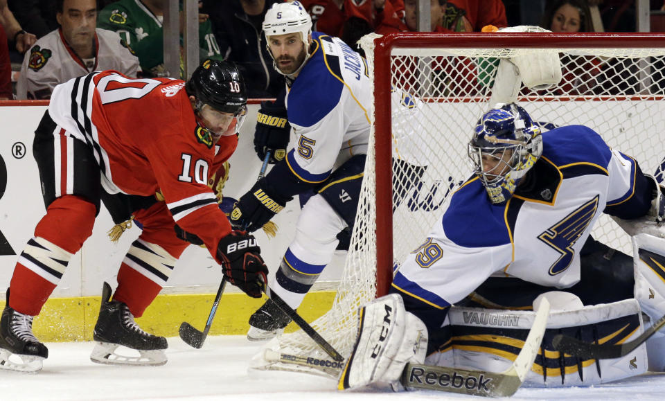 St. Louis Blues goalie Ryan Miller (39) blocks a shot by Chicago Blackhawks' Patrick Sharp (10) during the second period in Game 4 of a first-round NHL hockey playoff series in Chicago, Wednesday, April 23, 2014. (AP Photo/Nam Y. Huh)