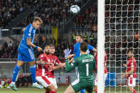 Italy's Mateo Retegui, left, scores his side's opening goal during the Euro 2024 group C qualifying soccer match between Malta and Italy at the National stadium in Ta' Qali, near Valletta, Malta, Sunday, March 26, 2023. (AP Photo/Rene Rossignaud)