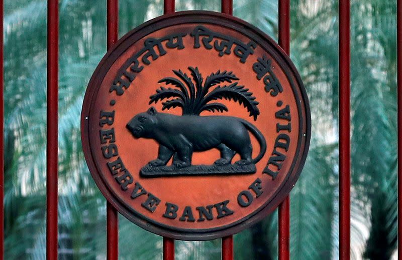 FILE PHOTO: Reserve Bank of India logo is seen at the gate of its office in New Delhi