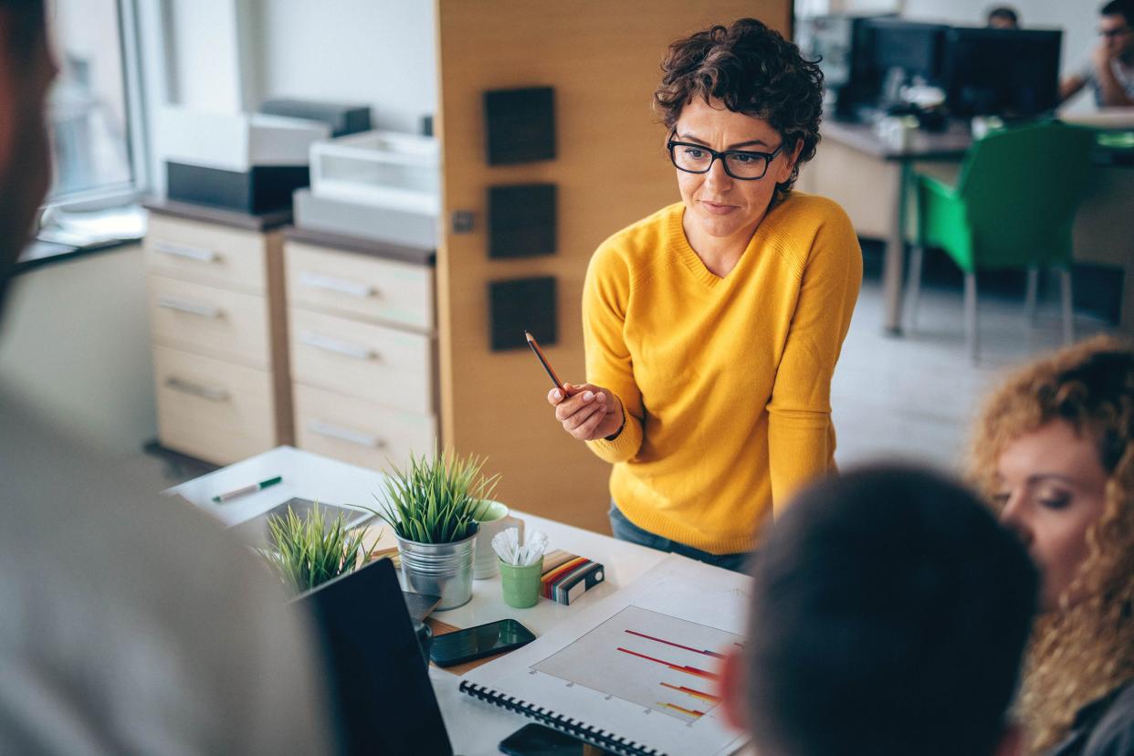 woman director at head of meeting