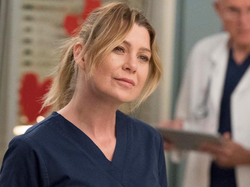 Ellen Pompeo in navy blue scrubs