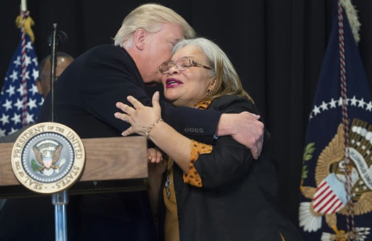US President Donald Trump hugs Alveda King (R), neice of civil rights icon Dr. Martin Luther King, Jr., following a tour of the Smithsonian National Museum of African American History and Culture on February 21, 2017