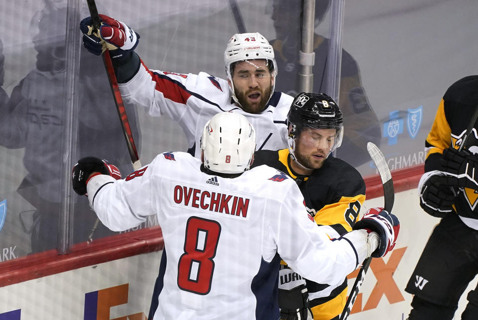 Washington Capitals' Tom Wilson (43) celebrates his first of two goals during the first period of the team's NHL hockey game against the Washington Capitals in Pittsburgh, Tuesday, Jan. 19, 2021. (AP Photo/Gene J. Puskar)