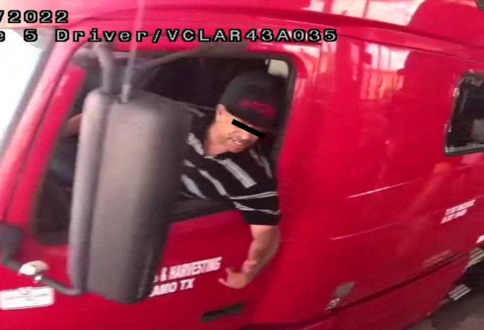 The alleged driver of a truck carrying dozens of migrants, identified by Mexican immigration officials as ‘Homero N’, drives through a security checkpoint in this surveillance photograph in Laredo, Texas, in this handout photo distributed to Reuters on June 29, 2022 (via REUTERS)