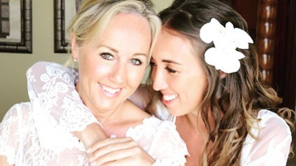 Shirlie Kemp in a lace wedding dress with her daughter Harley Moon