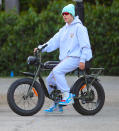 <p>Another day, another outing for Justin Bieber, who takes his electric bike for a spin on Thursday in Beverly Hills. </p>