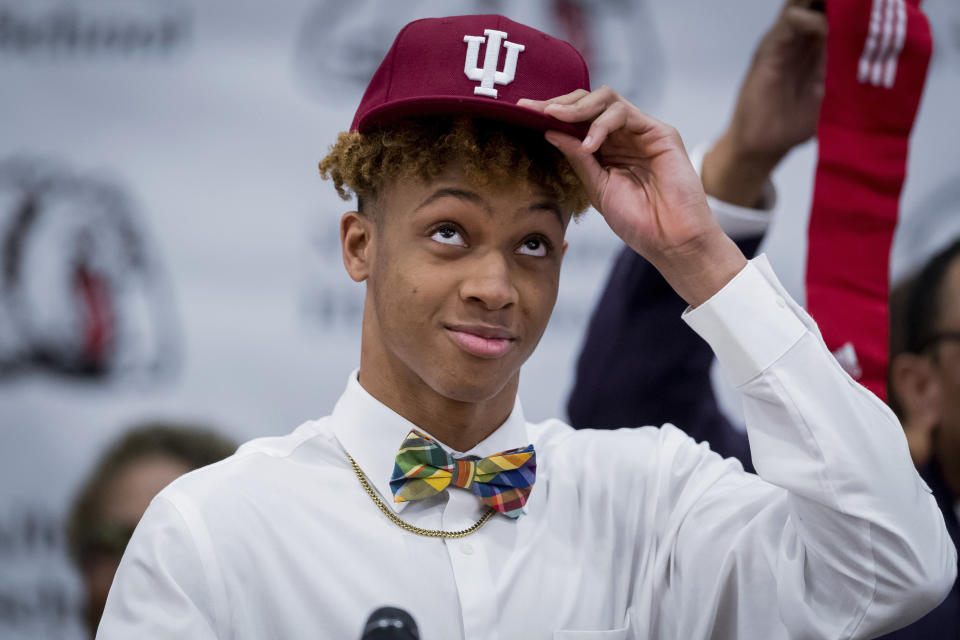 After plenty of ceremonial pomp, Romeo Langford put an Indiana hat to commit to the Hoosies. (AP)