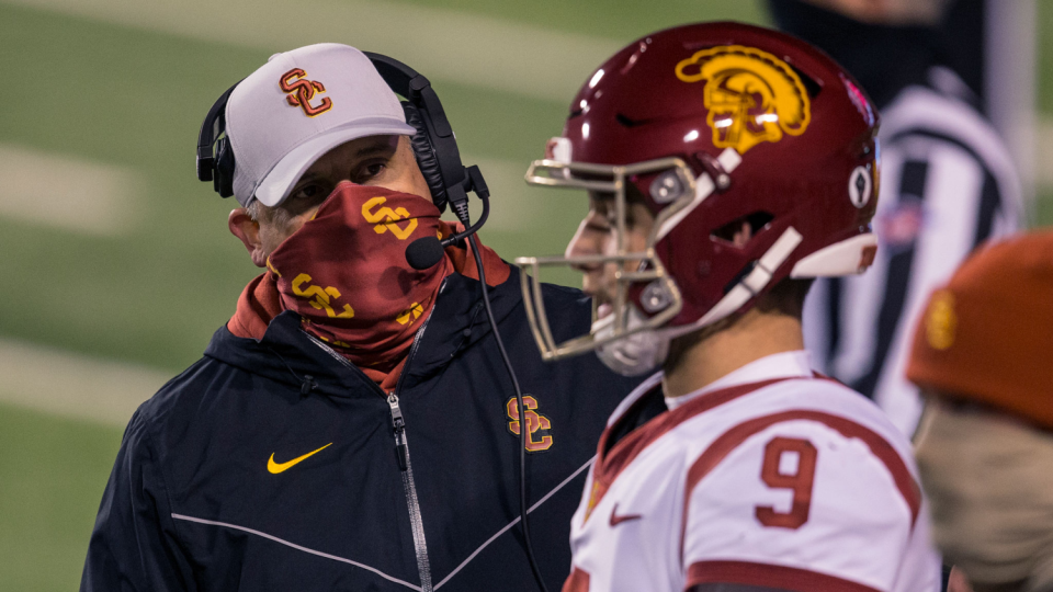 USC coach Clay Helton speaks with quarterback Kedon Slovis during a win over Utah on Nov. 21.