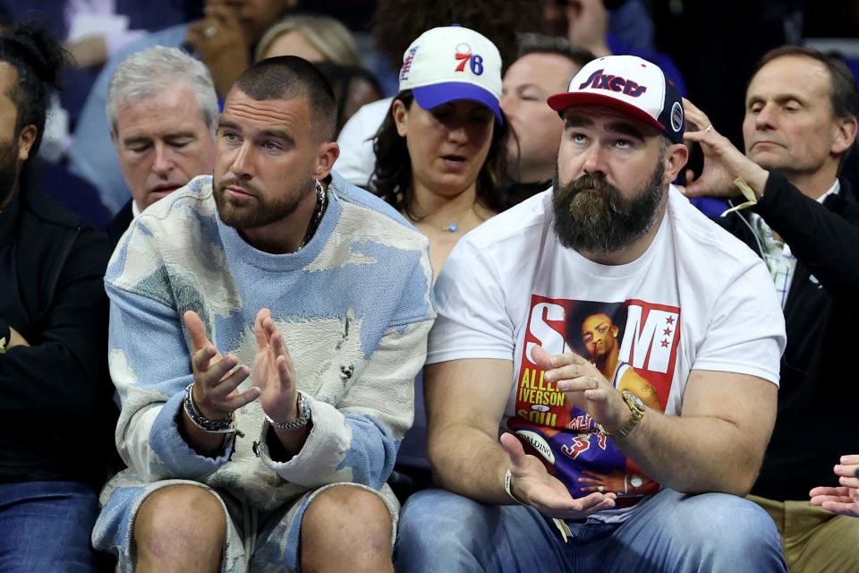 PHILADELPHIA, PENNSYLVANIA - MAY 11: (L-R) Travis Kelce of the Kansas City Chiefs and Jason Kelce of the Philadelphia Eagles watch game six of the Eastern Conference Semifinals in the 2023 NBA Playoffs between the Boston Celtics and the Philadelphia 76ers at Wells Fargo Center on May 11, 2023 in Philadelphia, Pennsylvania. NOTE TO USER: User expressly acknowledges and agrees that, by downloading and or using this photograph, User is consenting to the terms and conditions of the Getty Images License Agreement. (Photo by Tim Nwachukwu/Getty Images)