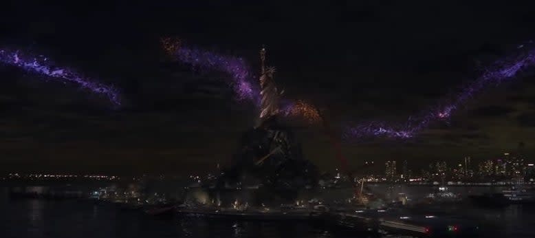 Purple inter-dimensional rifts forming in the sky around the Statue of Liberty in "Spider-Man: No Way Home"