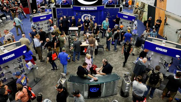 PHOTO: People attend the National Rifle Association (NRA) annual convention in Indianapolis, on April 14, 2023. (Evelyn Hockstein/Reuters)