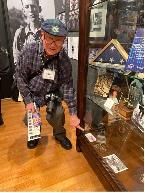 Jim Grant pointing to Ed Westcott’s QSL card on display in the Oak Ridge History Museum.