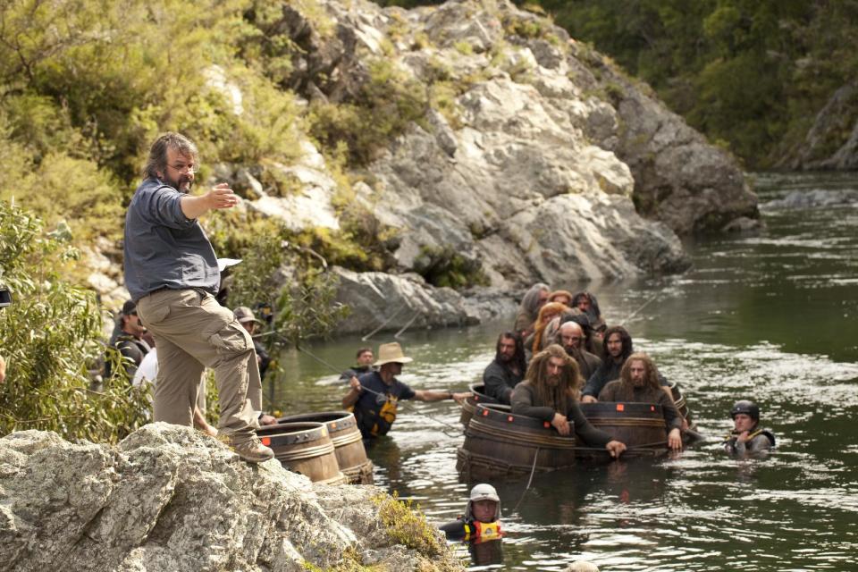This image released by Warner Bros. Pictures shows director Peter Jackson, left, during the filming of "The Hobbit: The Desolation of Smaug." When Jackson released the first of his three "Hobbit" films last year, he trumpeted the film's double-speed frame rate as a major innovation for moviemaking. With the release Friday of his "The Hobbit: The Desolation of Smaug," Jackson is being much quieter on the film's 48 frames-per-second, with the hopes that the movie's story won't be overshadowed by technology. (AP Photo/Warner Bros. Pictures, James Fisher)