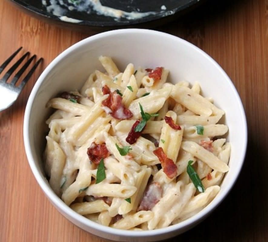 <p>Foody Schmoody Blog</p><p>Rotisserie chicken or pre-cooked chicken help make this an easy weeknight meal the entire family will want to devour.</p><p><strong>Get the recipe: <a href="https://foodyschmoodyblog.com/creamy-garlic-pasta-bacon-chicken/" rel="nofollow noopener" target="_blank" data-ylk="slk:Creamy Garlic Penne With Bacon And Chicken;elm:context_link;itc:0;sec:content-canvas" class="link rapid-noclick-resp">Creamy Garlic Penne With Bacon And Chicken</a></strong></p>