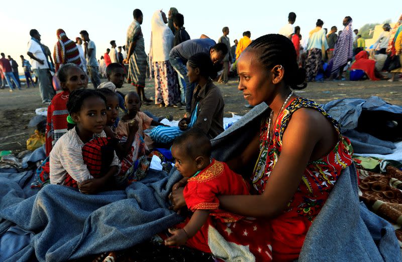 FILE PHOTO: Ethiopian women who fled the ongoing fighting in Tigray region, gather in Hamdayet village near the Setit river on the Sudan-Ethiopia border in eastern Kassala state