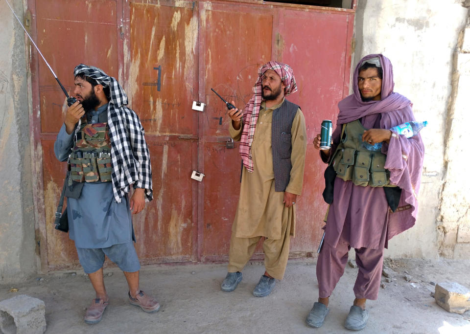 Taliban fighters stand guard at a checkpoint inside the city of Farah, capital of Farah province, southwest Afghanistan, Wednesday, Aug. 11, 2021. Afghan officials say three more provincial capitals have fallen to the Taliban, putting nine out of the country’s 34 in the insurgents’ hands amid the U.S. withdrawal. The officials told The Associated Press on Wednesday that the capitals of Badakhshan, Baghlan and Farah provinces all fell. (AP Photo/Mohammad Asif Khan)