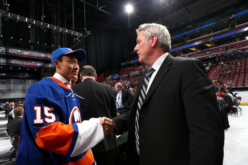 SUNRISE, FL - JUNE 27:  AnDong Song reacts after being selected 172nd overall by the New York Islanders during the 2015 NHL Draft at BB&T Center on June 27, 2015 in Sunrise, Florida.  (Photo by Bruce Bennett/Getty Images)